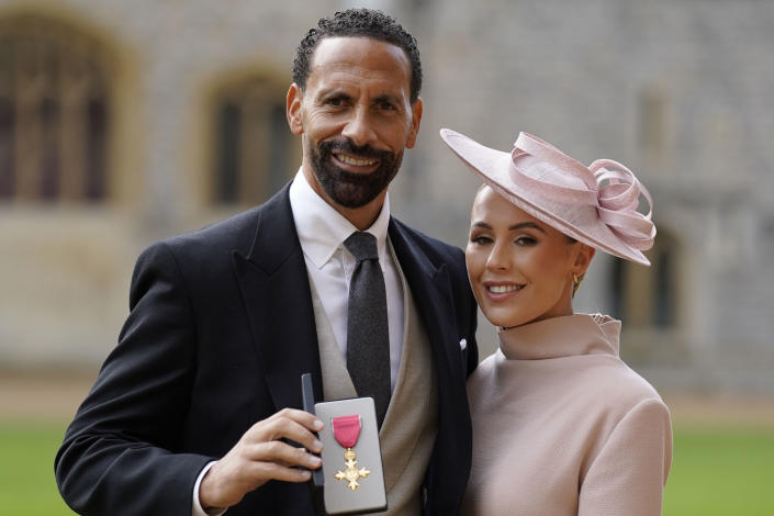 WINDSOR, ENGLAND - NOVEMBER 08: Rio Ferdinand and his wife Kate Ferdinand after being made an Officer of the Order of the British Empire by the Prince of Wales during an investiture ceremony at Windsor Castle on November 8, 2022 in Windsor, England. (Photo by Andrew Matthews - Pool/Getty Images)