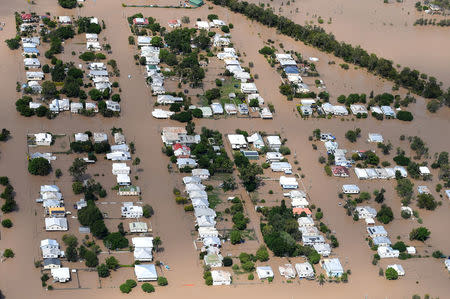 Houses are surrounded by floodwaters brought on by Cyclone Debbie in Rockhampton, Australia, April 6, 2017. AAP/Dan Peled/via REUTERS