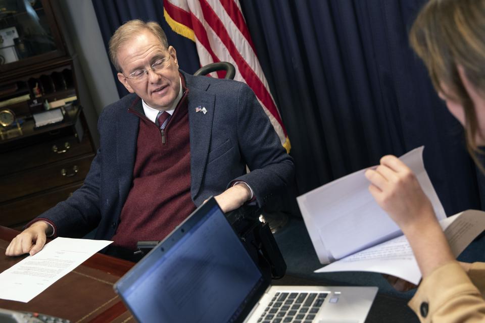 Rep. Jim Langevin, D-R.I., works with staff assistant Katherine Riordan in his office, Friday, March 25, 2022, in Warwick, R.I. After the Capitol riot, Langevin said he thought briefly that the foolishness and recklessness of dividing the country would finally stop. That didn’t happen, and the Rhode Island Democrat says it’s one reason why he’s leaving Congress. (AP Photo/Michael Dwyer)