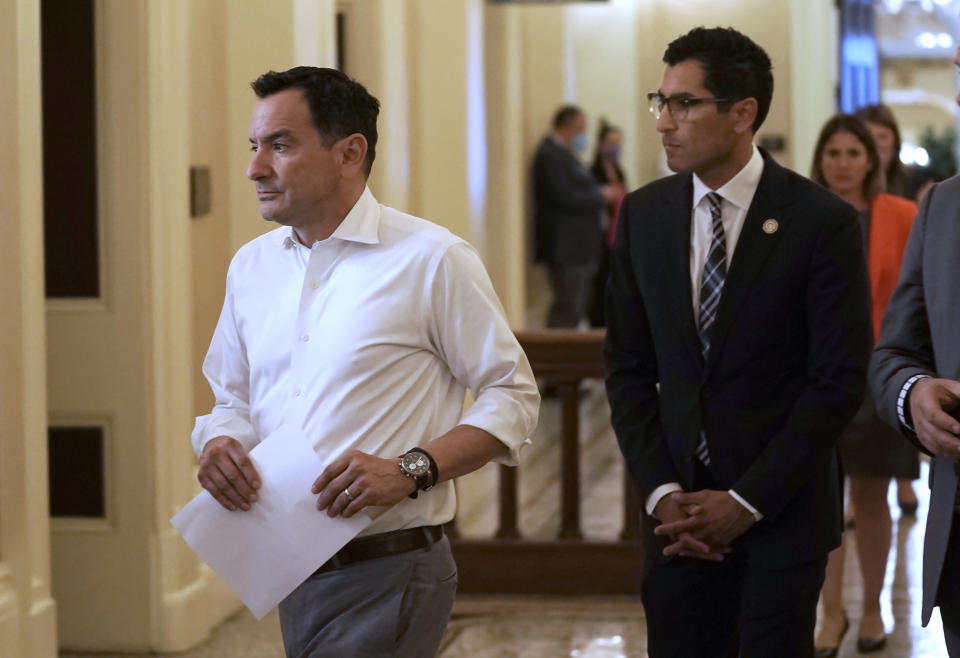 FILE – Assembly Speaker Anthony Rendon, left, and Assemblymember Robert Rivas walk into a meeting of the Democratic caucus at the state capitol in Sacramento, California, on May 31, 2022. Rivas will replace Rendon as speaker on Friday, June 30, 2023. Rendon has been Speaker since 2016, making him the second-longest serving speaker in state history. (AP Photo/Rich Pedroncelli, File)