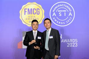 Ray Lai (on the left), on behalf of Millennium Group, accepts the award