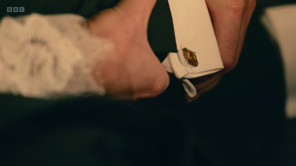 Amber cufflinks seen on the unknown male who has been killed at the Vic