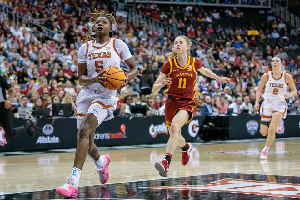 Mar 12, 2024; Kansas City, MO, USA; Texas Longhorns forward DeYona Gaston (5) drives to the basket during the first half against the Iowa State Cyclones at T-Mobile Center. Mandatory Credit: William Purnell-USA TODAY Sports