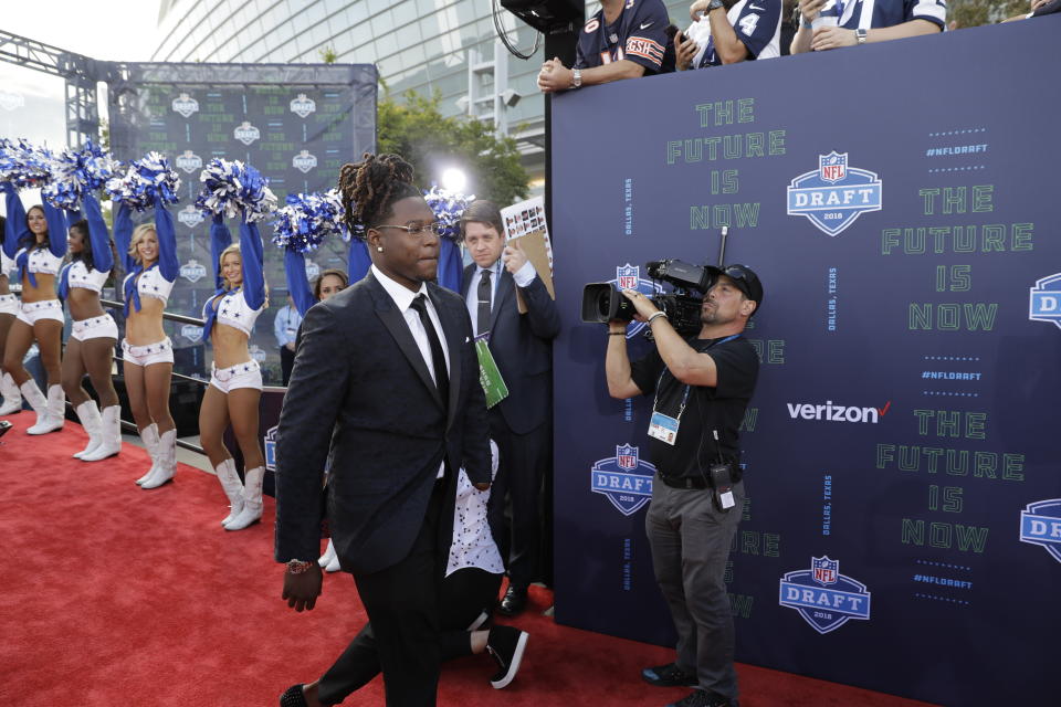 UCF's Shaquem Griffin, strolling down the red carpet at the NFL draft on Thursday, had to wait a bit for his name to be called. (AP) 