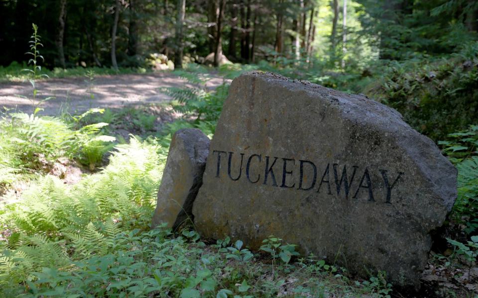 A boulder at the end of a track leading to the house where Ghislaine Maxwell is believed to have been staying - REUTERS