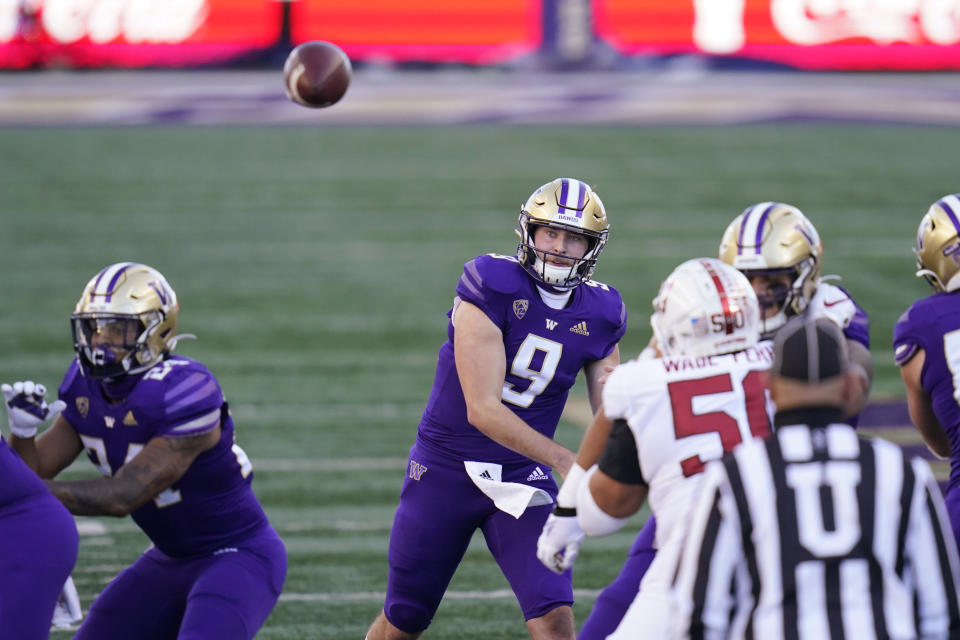 Washington quarterback Dylan Morris (9) throws against Stanford in the first half of an NCAA college football game Saturday, Dec. 5, 2020, in Seattle. (AP Photo/Elaine Thompson)