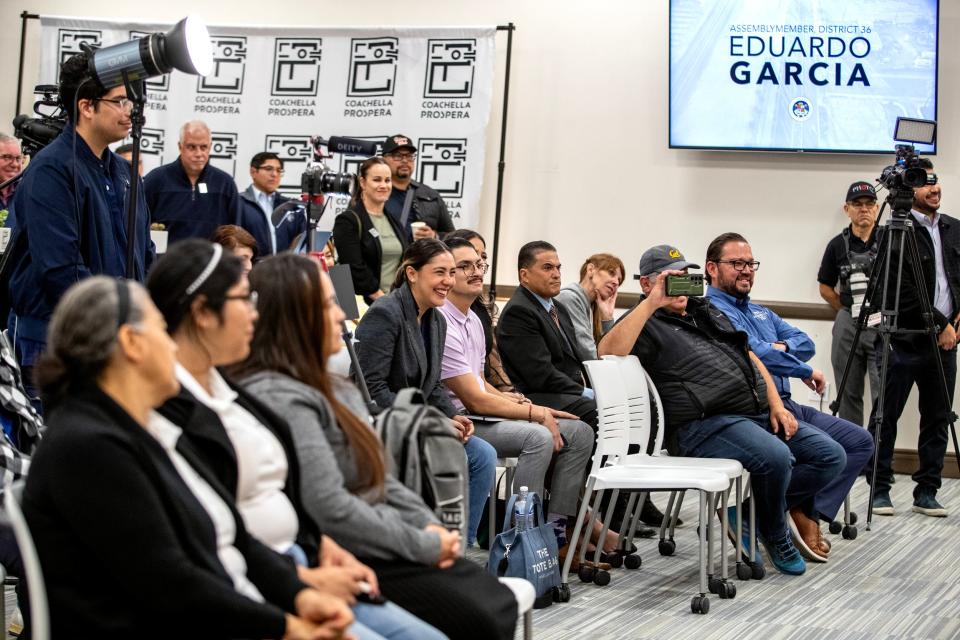 Community leaders and residents listen during a press conference to announce the city of Coachella being awarded a $22 million state Transformative Climate Communities Grant to fund the community-led Coachella Prospera projects in Coachella, Calif., on Tuesday, December 19, 2023.