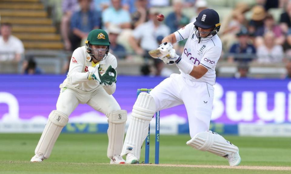 Joe Root reverse ramps the ball for six off the bowling of Scott Boland