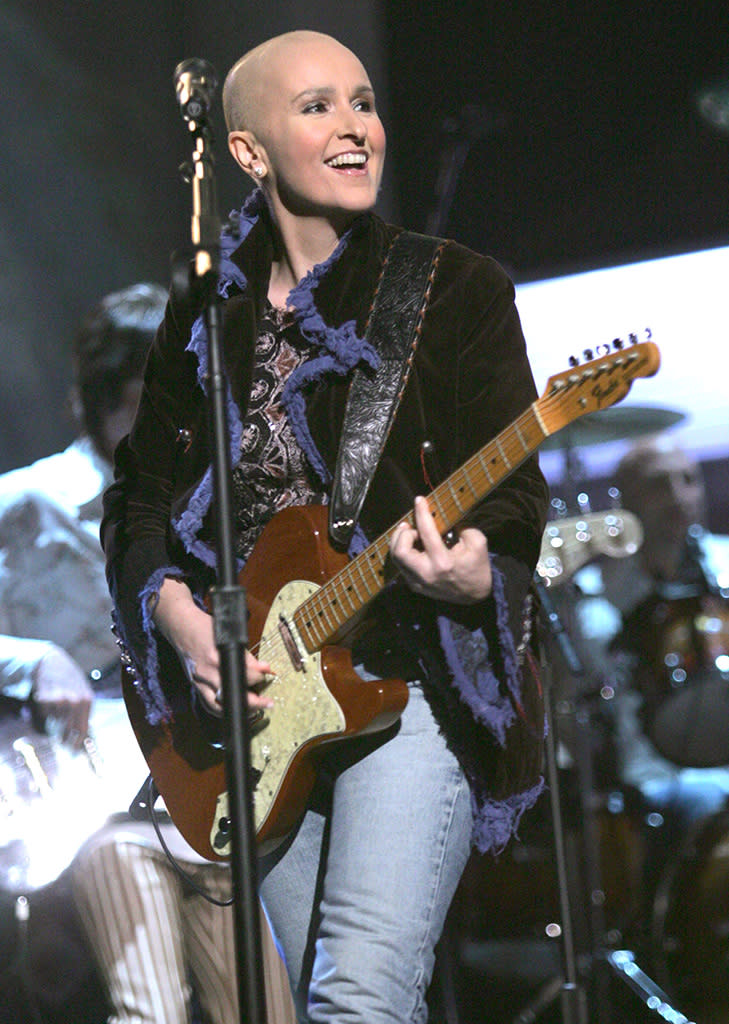 Melissa Etheridge performs at the Grammys after breast cancer surgery.