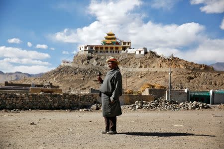 Dorsey Takapa, 65, a retired goat herder poses for a photograph in Choklamsar, a village nestled high in the Indian Himalayas, India September 27, 2016. When asked how living in the worlds fastest growing major economy had affected life, Takapa replied: "Traditional values are being lost as we focus on money." REUTERS/Cathal McNaughton SEARCH "LADAKH" FOR THIS STORY. SEARCH "WIDER IMAGE" FOR ALL STORIES. - RTSRWU8