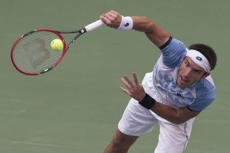 Leonardo Mayer of Argentina serves to Roger Federer of Switzerland during their first round match at the U.S. Open Championships tennis tournament in New York, September 1, 2015. REUTERS/Adrees Latif