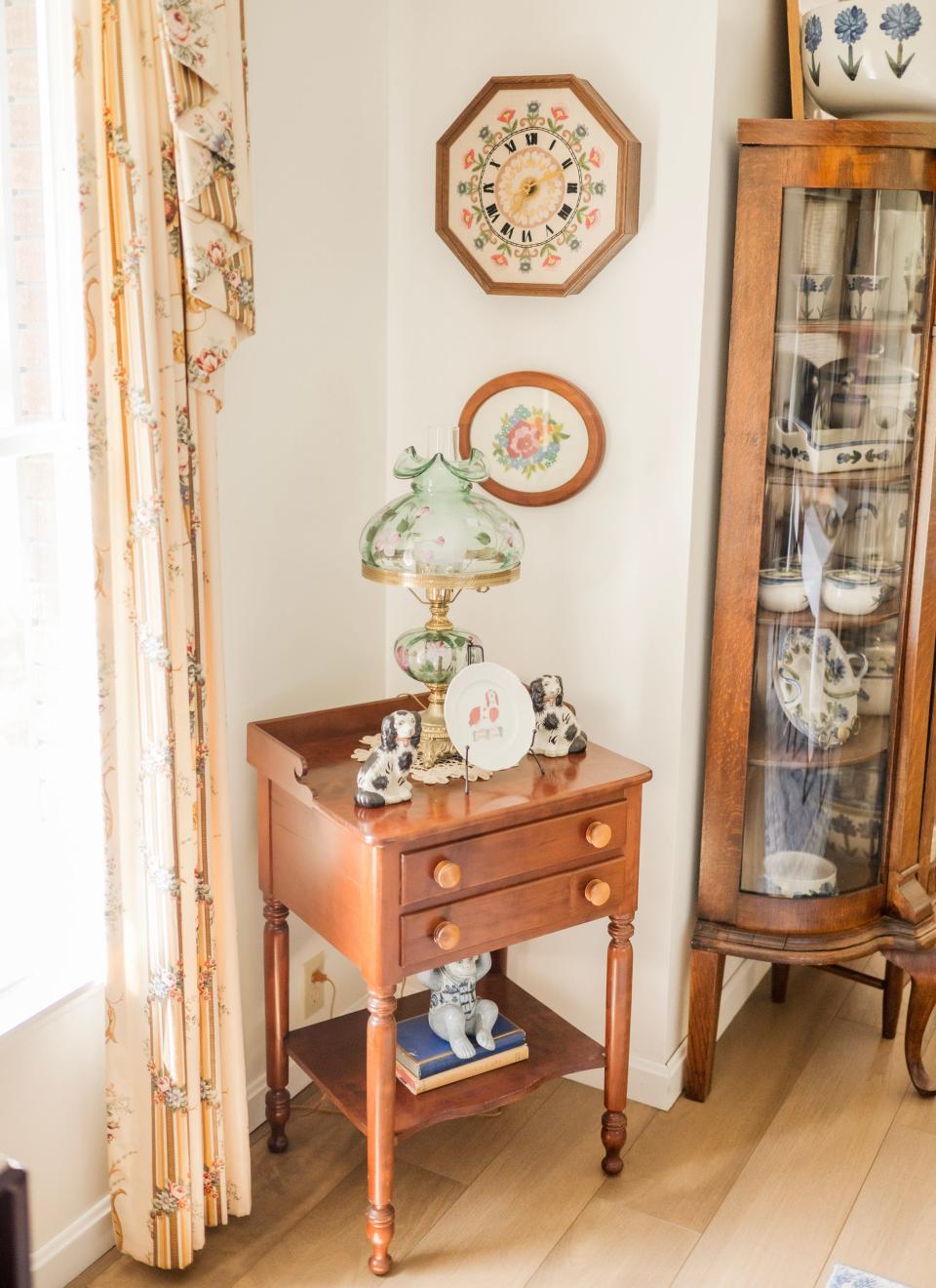 Beneath the wall clock in this Russell Springs, Kentucky home is the last cross-stitch piece that the homeowner’s late aunt ever made.