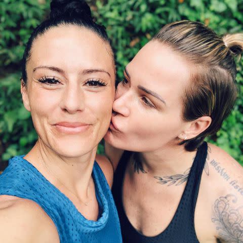 <p>Ali Krieger/ Instagram</p> Ali Krieger and Ashlyn Harris share a kiss