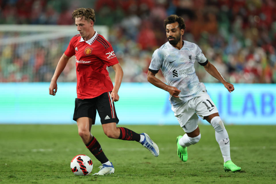 Manchester United's Charlie Savage and Liverpool's Mohamed Salah battling for possession during the pre-season friendly match in Bangkok. 