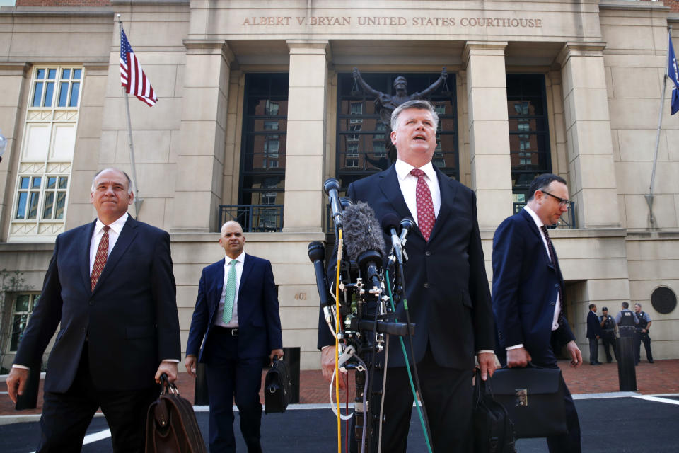 <p>Defense attorney Kevin Downing, second from right, makes a statement to the media after leaving federal court in the trial of former Donald Trump campaign chairman Paul Manafort, in Alexandria, Va., Tuesday, Aug. 14, 2018. (Photo: Jacquelyn Martin/AP) </p>