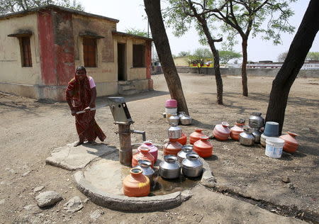 Fatima Mulani uses a hand-pump to collect water at a Primary Health Centre in Latur, April 16, 2016. REUTERS/Danish Siddiqui