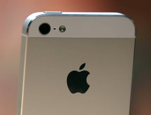 The new iPhone 5 is displayed during an Apple special event. Apple's iPhone 5 is one of the biggest product launches ever in the sector, and may also deliver a well-timed stimulus to the US economy ahead of the presidential election, analysts say