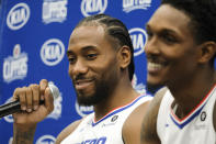 Los Angeles Clippers forward Kawhi Leonard, left, and guard Lou Williams attend the NBA basketball team's media day in Los Angeles, Sunday, Sept. 29, 2019. (AP Photo/Ringo H.W. Chiu)