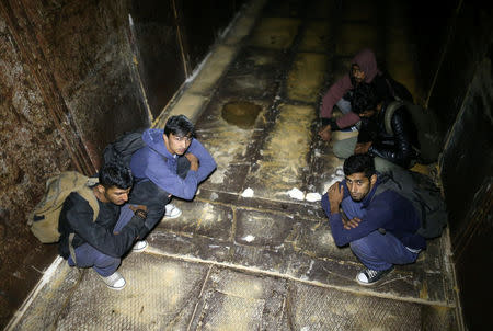 Migrants are stopped by the border police as they hide in a freight train while trying to cross the Bosnian border from Serbia, near Zvornik, Bosnia and Herzegovina September 1, 2018. REUTERS/Dado Ruvic