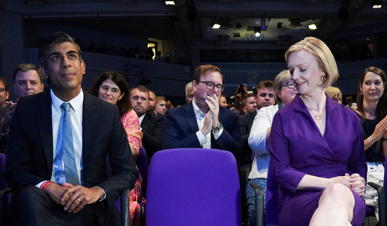 New Conservative Party leader and Britain's Prime Minister-elect Liz Truss (R) reacts next to Britain's former Chancellor of the Exchequer and a contender to become the country's next Prime Minister and leader of the Conservative party Rishi Sunak (L) during the announcement of the winner of the Conservative Party leadership contest in central London on September 5, 2022. - Truss is the UK's third female prime minister following Theresa May and Margaret Thatcher. The 47-year-old has consistently enjoyed overwhelming support over 42-year-old Sunak in polling of the estimated 200,000 Tory members who were eligible to vote. (Photo by Stefan Rousseau / POOL / AFP) (Photo by STEFAN ROUSSEAU/POOL/AFP via Getty Images)