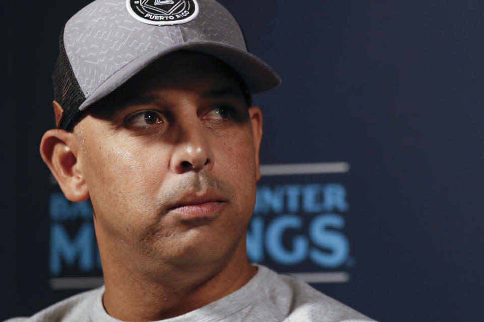 FILE - In this Dec. 9, 2019, file photo, Boston Red Sox manager Alex Cora listens to a question during the Major League Baseball winter meetings, in San Diego. Houston manager AJ Hinch and general manager Jeff Luhnow were suspended for the entire season Monday, Jan. 13, 2020, and the team was fined $5 million for sign-stealing by the team in 2017 and 2018 season. Commissioner Rob Manfred announced the discipline and strongly hinted that current Boston manager Alex Cora — the Astros bench coach in 2017 — will face punishment later. Manfred said Cora developed the sign-stealing system used by the Astros. (AP Photo/Gregory Bull, File)