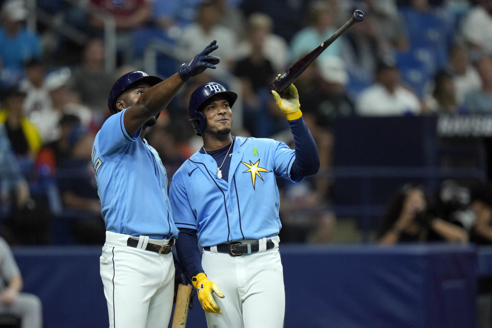 Tampa Bay Rays' Wander Franco, right, and Randy Arozarena point to where Franco's ball went foul after a pitch from Detroit Tigers' Alex Faedo during a review in the sixth inning of a baseball game Monday, May 16, 2022, in St. Petersburg, Fla. Umpires confirmed the ball went foul. (AP Photo/Chris O'Meara)