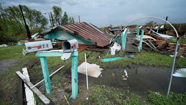 PHOTO: Storm clouds from Tropical Storm Nicholas are seen behind homes of the vanishing Native American community of Isle de Jean Charles, La., which were destroyed by Hurricane Ida, Sept. 14, 2021. (Gerald Herbert/AP)