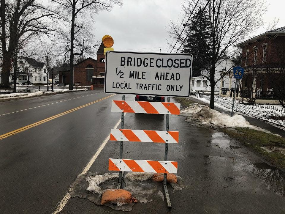 A sign cautions motorists that the county Road 26 bridge over the Genesee River in the Town of Belfast in Allegany County is closed.