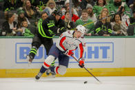 Dallas Stars left wing Jamie Benn (14) collides with Washington Capitals center Dylan Strome (17) during the second period of an NHL hockey game, Saturday, Jan. 27, 2024, in Dallas. (AP Photo/Gareth Patterson)