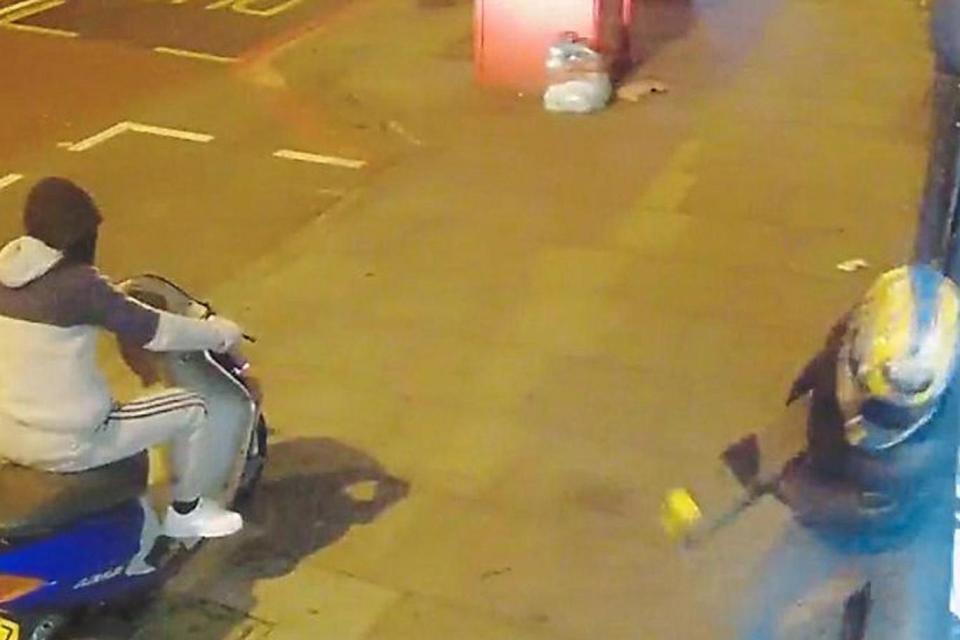 The burglar takes a breeze block to the shop's window