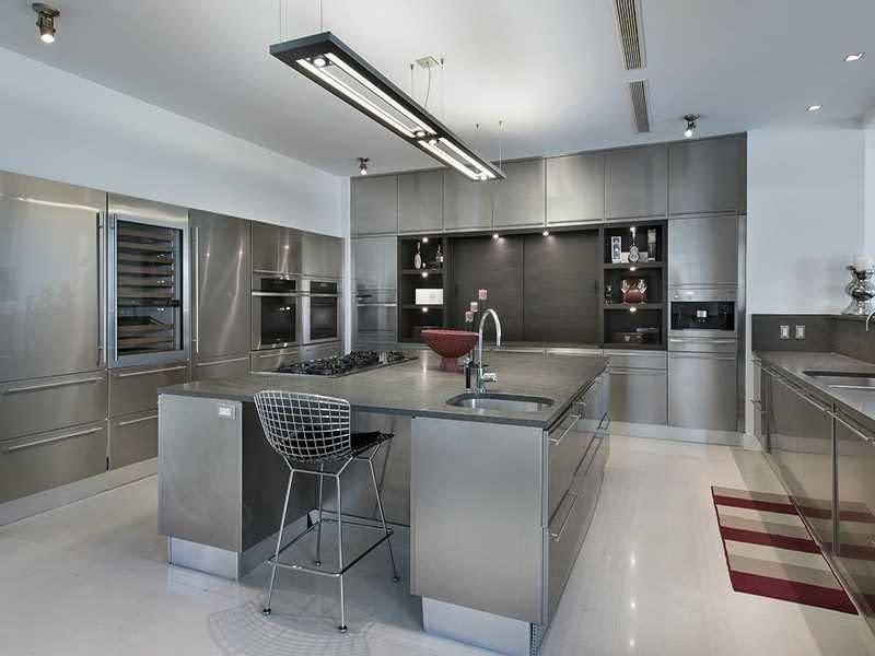 <p>The ultra-modern kitchen boasts a massive island. (Realtor.com) </p>