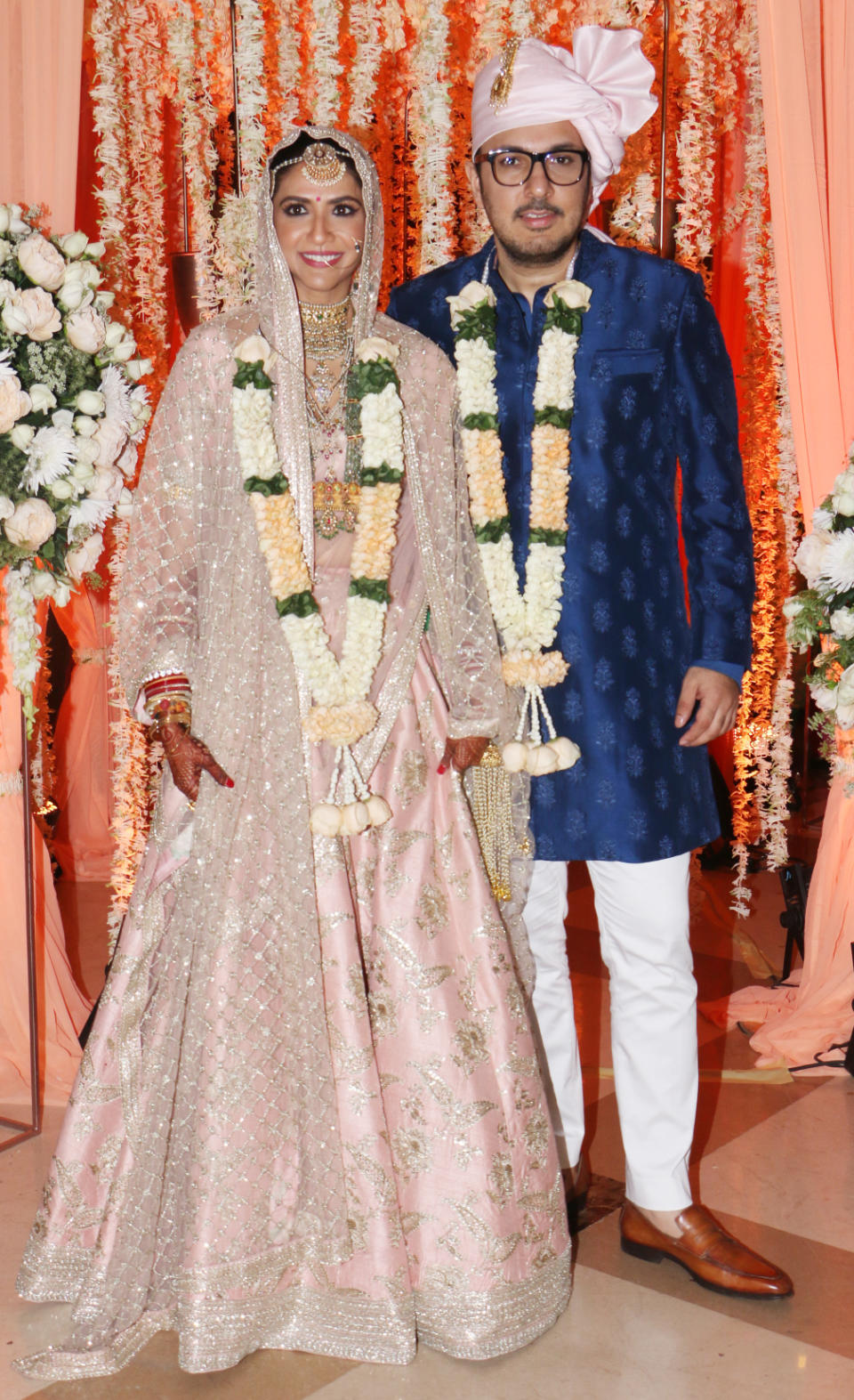 The newly weds pose in their wedding finery.