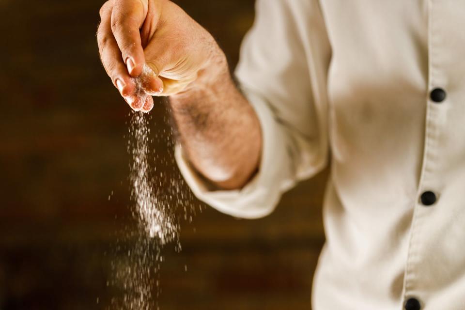 Many people could do with a pinch less of salt. <a href="https://www.gettyimages.com/detail/photo/close-up-of-a-chef-adding-salt-into-his-recipe-royalty-free-image/1339981307" rel="nofollow noopener" target="_blank" data-ylk="slk:skynesher/E+ via Getty Images;elm:context_link;itc:0;sec:content-canvas" class="link ">skynesher/E+ via Getty Images</a>