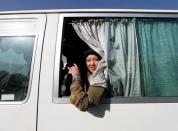 Zarmina Ahmadi, 22, a female soldier from the Afghan National Army (ANA) looks out from a bus window at the Kabul Military Training Centre (KMTC) in Kabul, Afghanistan October 26, 2016. REUTERS/Mohammad Ismail