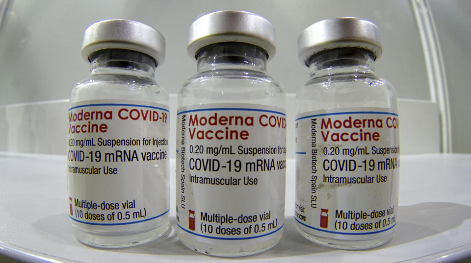 FILE - In this file photo dated Wednesday, Feb. 17, 2021, three vials of the Moderna COVID-19 Vaccine are pictured in a new coronavirus vaccination center at the 'Velodrom' (velodrome-stadium) in Berlin, Germany. The World Health Organization said that any COVID-19 vaccines it has authorized for emergency use should be recognized by countries as they open up their borders, in a move that could challenge Western countries to broaden their acceptance of two Chinese vaccines which the U.N. health agency has licensed, but most European and North American countries have not. (AP Photo/Michael Sohn, File)