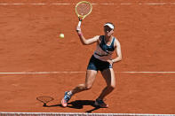 Czech Republic's Barbora Krejcikova volleys the ball as she plays with compatriot Katerina Siniakova again USA's Bethanie Mattek-Sands and Poland's Iga Swiatek during their women's doubles final match of the French Open tennis tournament at the Roland Garros stadium Sunday, June 13, 2021 in Paris. (AP Photo/Thibault Camus)