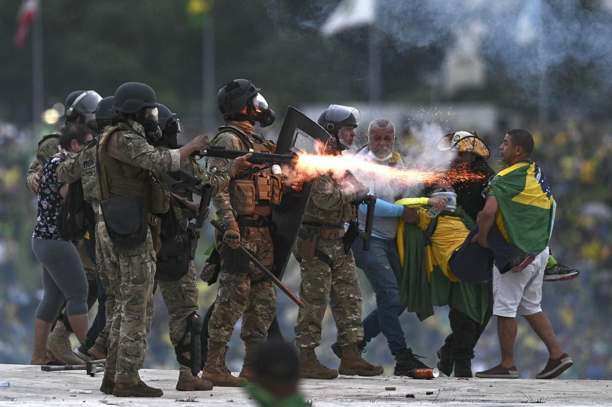 Police confront supporters of former Brazilian President Jair Bolsonaro invading Planalto Palace, in Brasília, Brazil, January 8, 2023. (Andre Borges/EPA-EFE/Shutterstock) 
