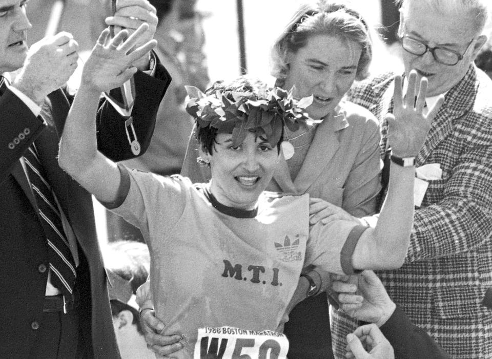 In this April 21, 1980 file photo, Rosie Ruiz waves to the crowd after after being announced as winner of the women's division of the Boston Marathon in Boston.