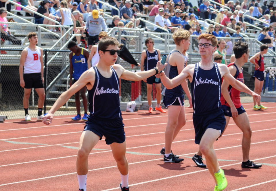 Whetstone's Nick Hainen, left, and Joshua Conroy compete in the 3,200-meter relay in the Gary Smith Invitational on Saturday at Thomas Worthington. The Braves finished eighth (8:59.48).