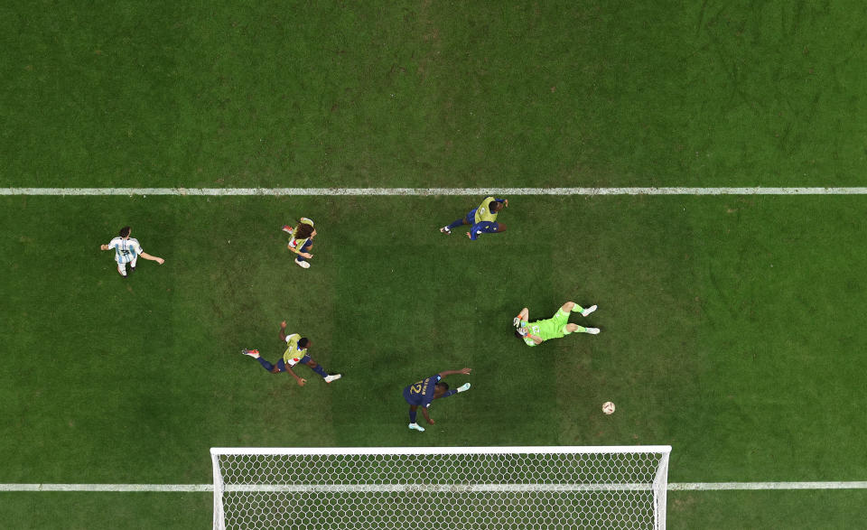 LUSAIL CITY, QATAR - DECEMBER 18: (EDITORS NOTE: In this photo taken from a remote camera from above the pitch) Emiliano Martinez of Argentina reacts after conceding the second goal to Kylian Mbappe (not pictured) of France during the FIFA World Cup Qatar 2022 Final match between Argentina and France at Lusail Stadium on December 18, 2022 in Lusail City, Qatar. (Photo by Dan Mullan/Getty Images)