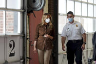 First lady Melania Trump talks with Chief Daniel Goonan as she visits the Manchester Fire Department Central Station, Thursday, Sept. 17, 2020, in Manchester, N.H. (AP Photo/Mary Schwalm)