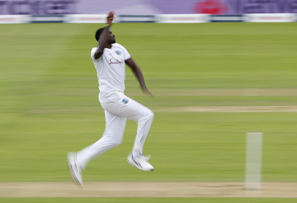West Indies' captain Jason Holder bowls a delivery during the second day of the first cricket Test match between England and West Indies, at the Ageas Bowl in Southampton, England, Thursday, July 9, 2020. (Adrian Dennis/Pool via AP)