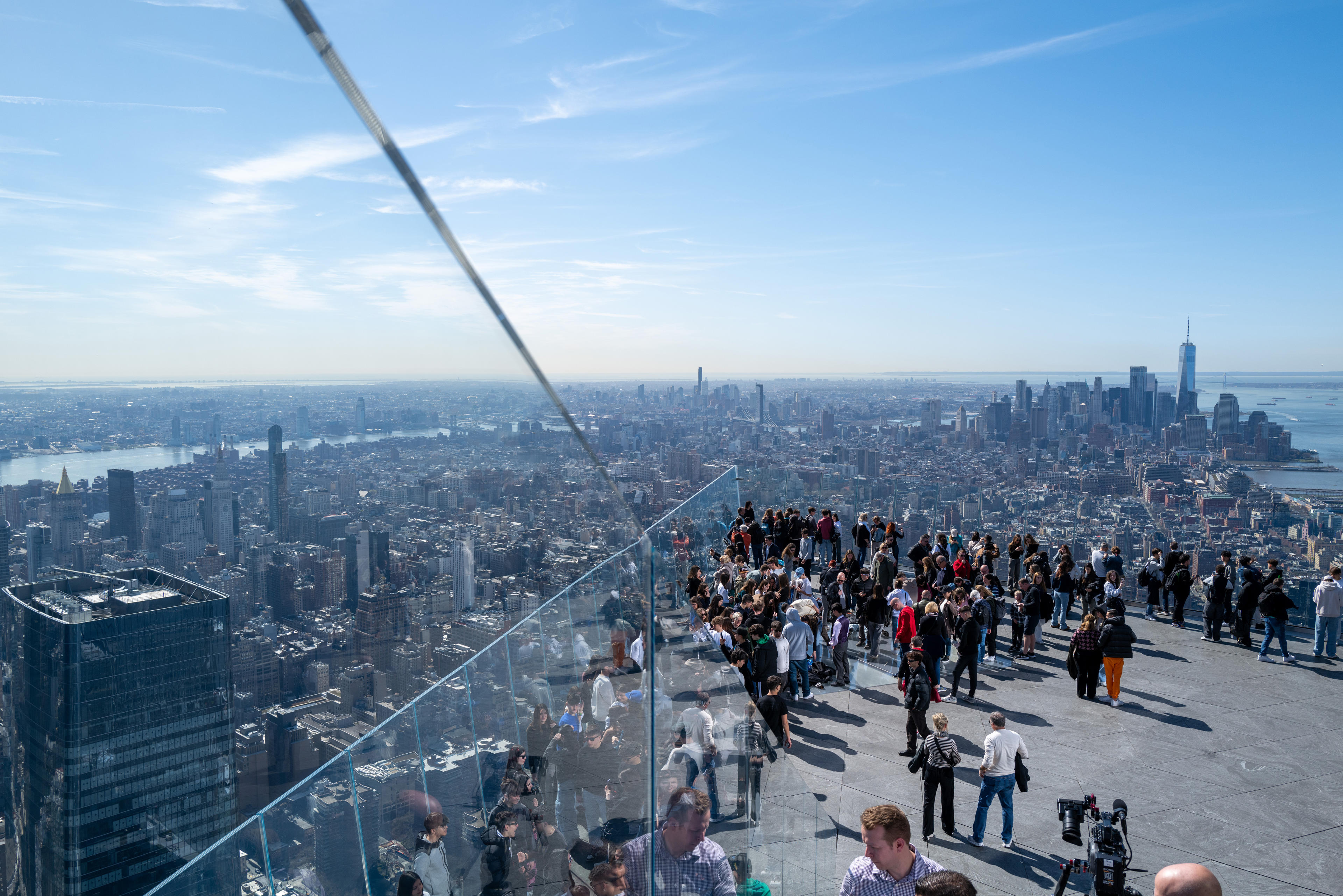 People gather on the observation deck of Edge at Hudson Yards before a partial solar eclipse on April 08, 2024 in New York City. (Spencer Platt/Getty Images)