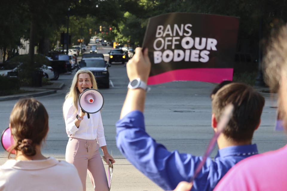 Democratic South Carolina Rep. Beth Bernstein leads chants at an abortion rights rally in Columbia, S.C., on Wednesday, Aug. 23, 2023. The South Carolina Supreme Court ruled Wednesday to uphold a law banning most abortions except in the earliest weeks of pregnancy. (AP Photo/James Pollard)