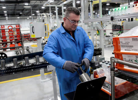 General Motors production worker Joseph Stanton works on the 10-speed transmission assembly at the General Motors (GM) Powertrain Transmission plant in Toledo, Ohio, U.S., March 6, 2019. REUTERS/Rebecca Cook/Files