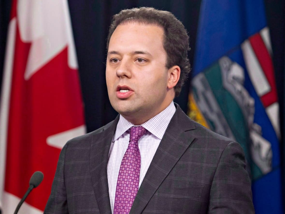 Jonathan Denis, pictured in this file photo as Alberta's justice minister in 2014, said he had no recollection of videos posted to social media that appear to be Denis making phone calls at an indeterminate time while performing a caricature of an Indigenous person. (Jason Franson/The Canadian Press - image credit)