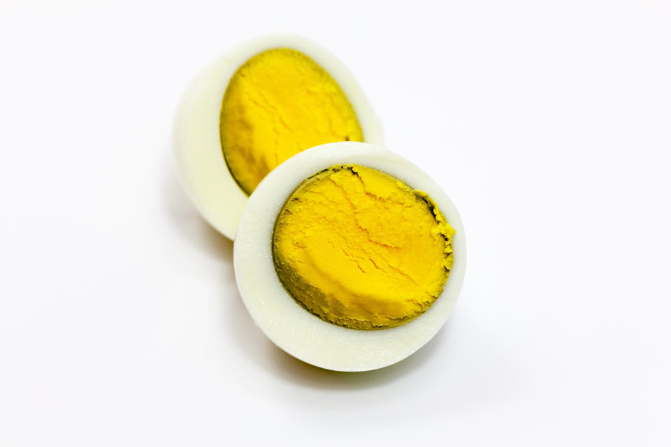 A hard-boiled egg with a dark ring around the yolk due to overcooking. (Photo: eag1e via Getty Images)