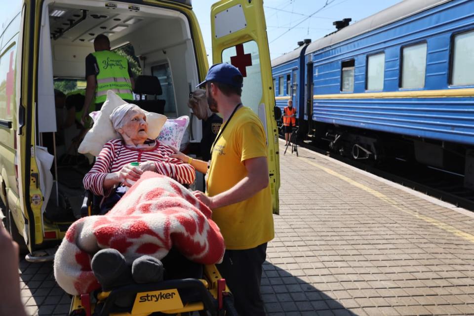 <div class="inline-image__caption"><p>An elderly woman is helped to a train which is taking evacuees trying to escape the front-line war with Russia on June 20 in Pokrovsk, Ukraine. </p></div> <div class="inline-image__credit">Scott Olson/Getty</div>
