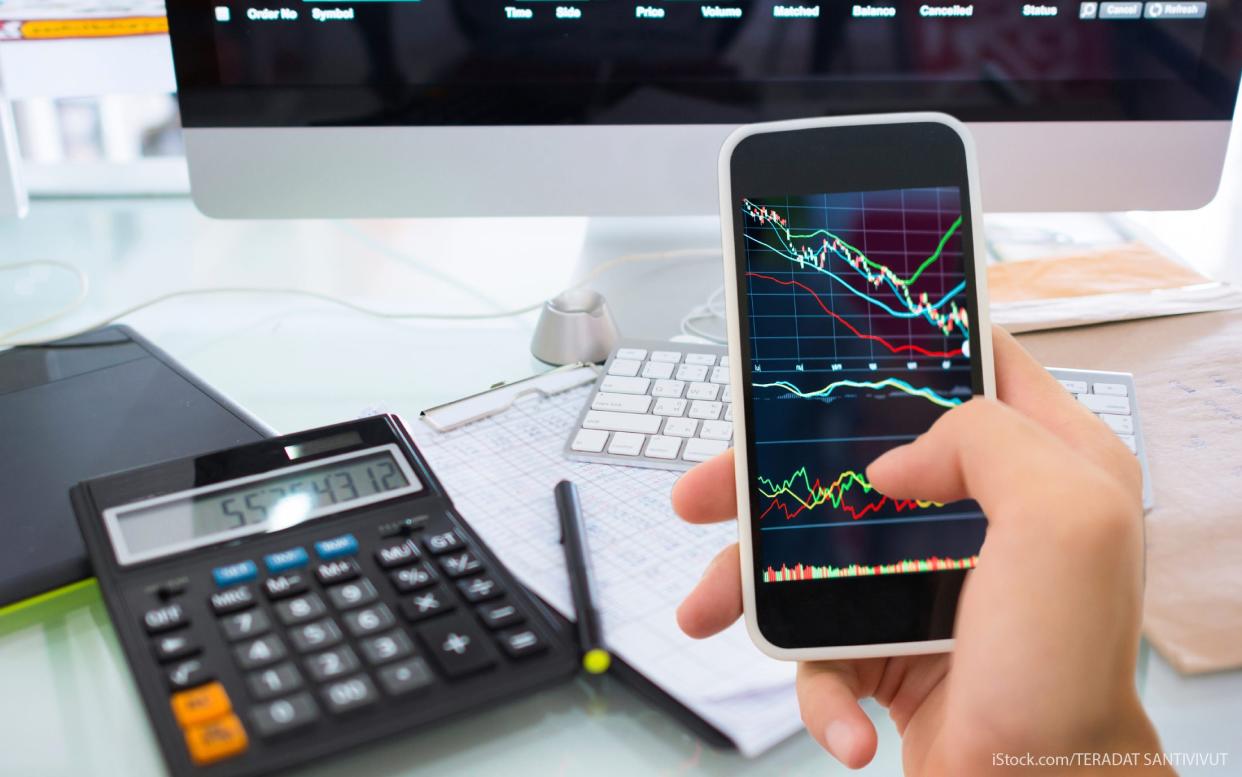 using a smartphone to check the stock market