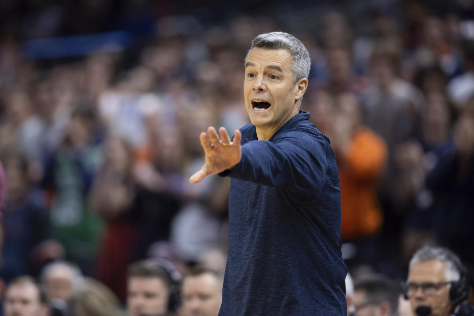 Virginia head coach Tony Bennett yells to his players during the first half of an NCAA college basketball game against Texas A&M in Charlottesville, Va., Wednesday, Nov. 29, 2023. (AP Photo/Mike Kropf)
